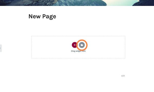 New page inside the Elementor page editor with a box that says "Drag widget here" and a button with a white folder (which should be clicked to reach the template library)